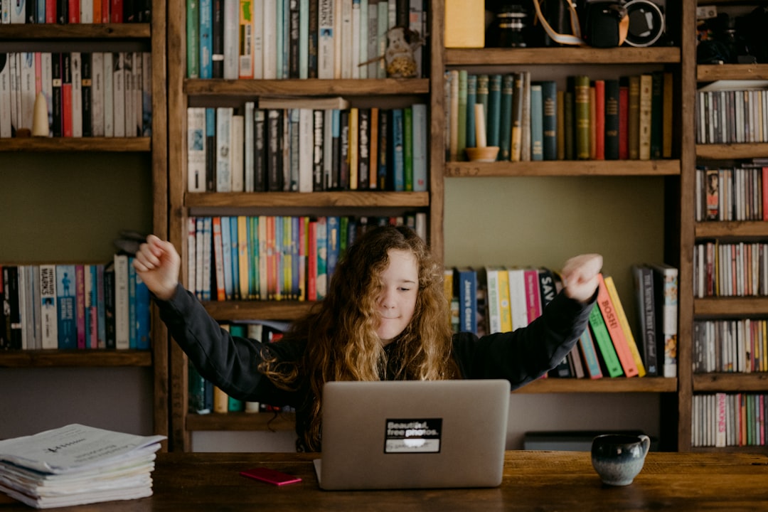 Young teen doing schoolwork at home after UK schools close due to the Coronavirus.
